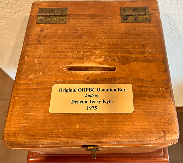 The cash and check donation box in the church foyer