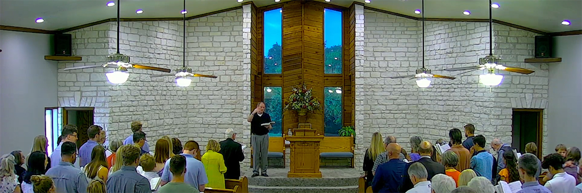 The Oak Hill congregation singing together during worship